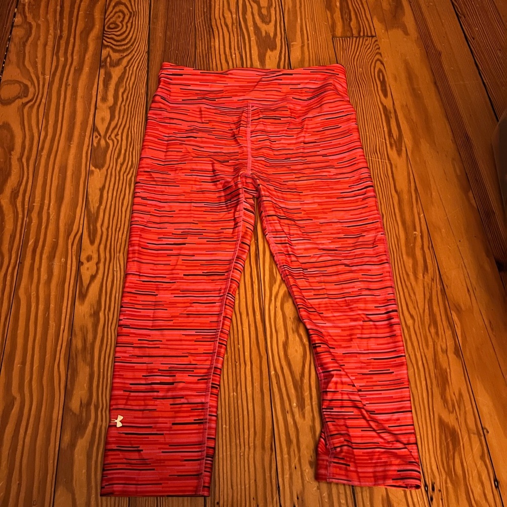 Under Armor red striped compression capris, sized medium
